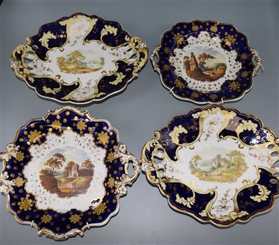 Four blue and gilt decorated porcelain plates
